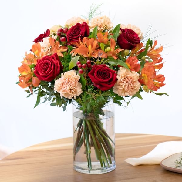 Mixed bouquet of warm orange and red tones